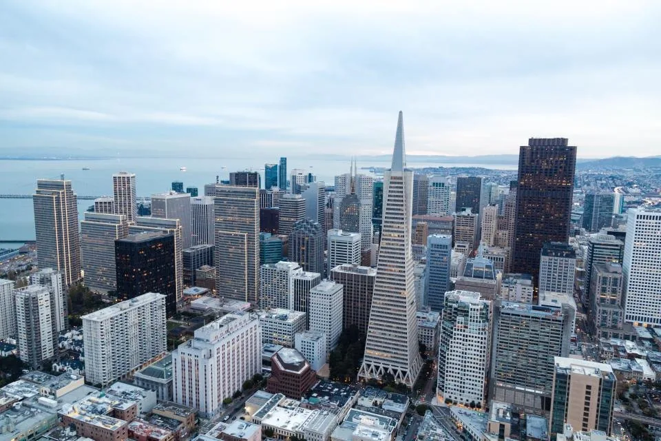 office buildings and towers photographed against an open sky