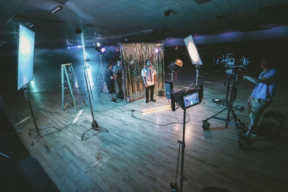 a professional camera on a tripod in a lit studio