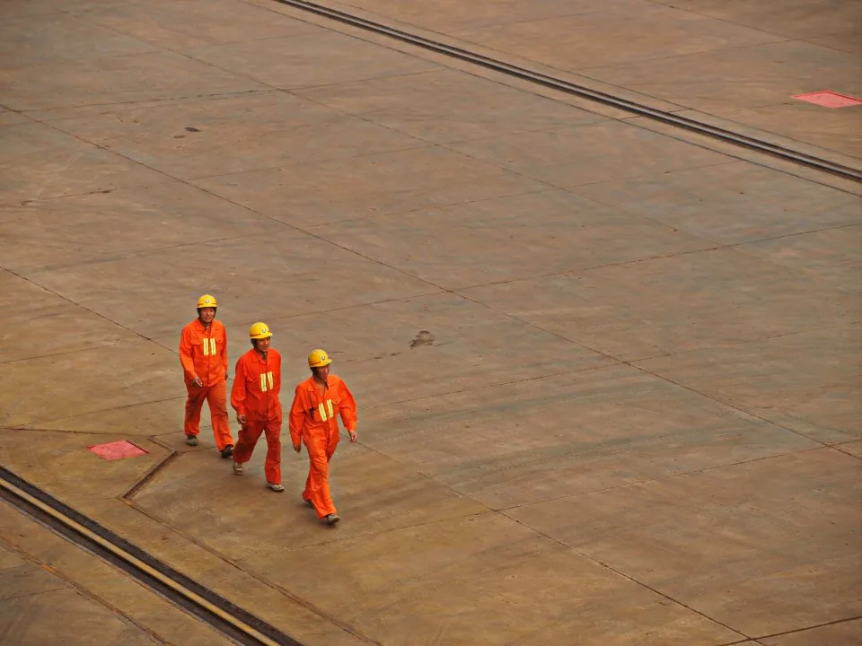 a building site with cranes and a partly finished structure