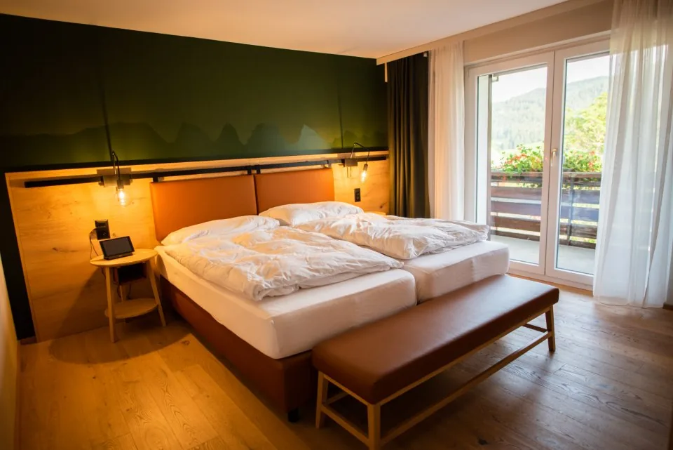 a hotel room and reception desk photographed in daylight