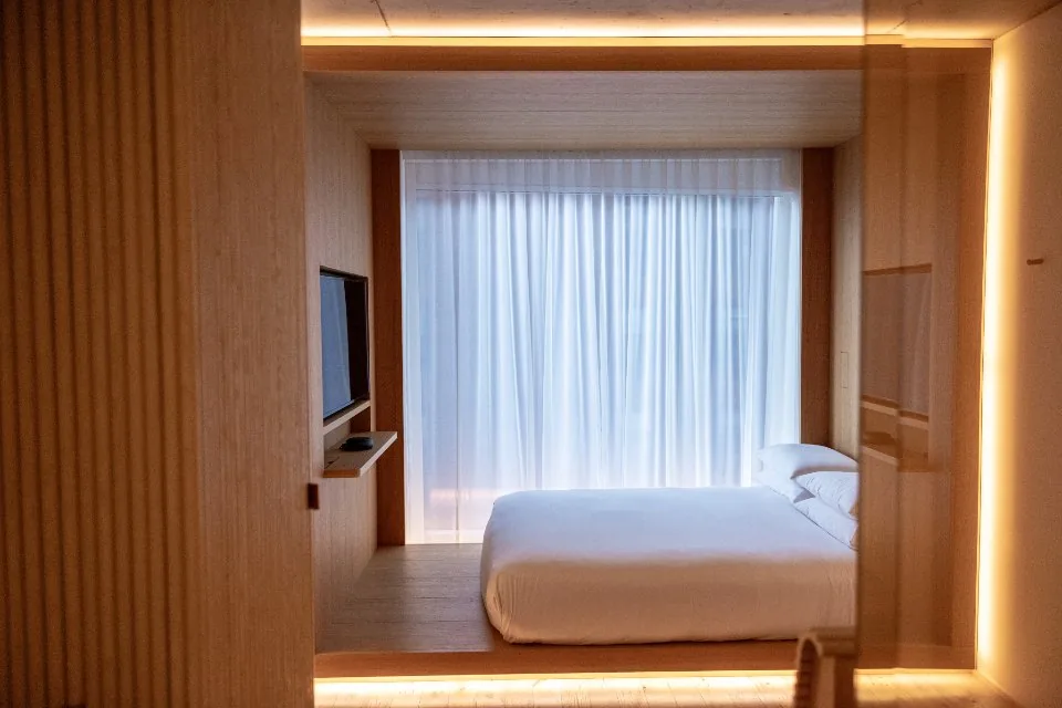 a hotel room and reception desk photographed in daylight