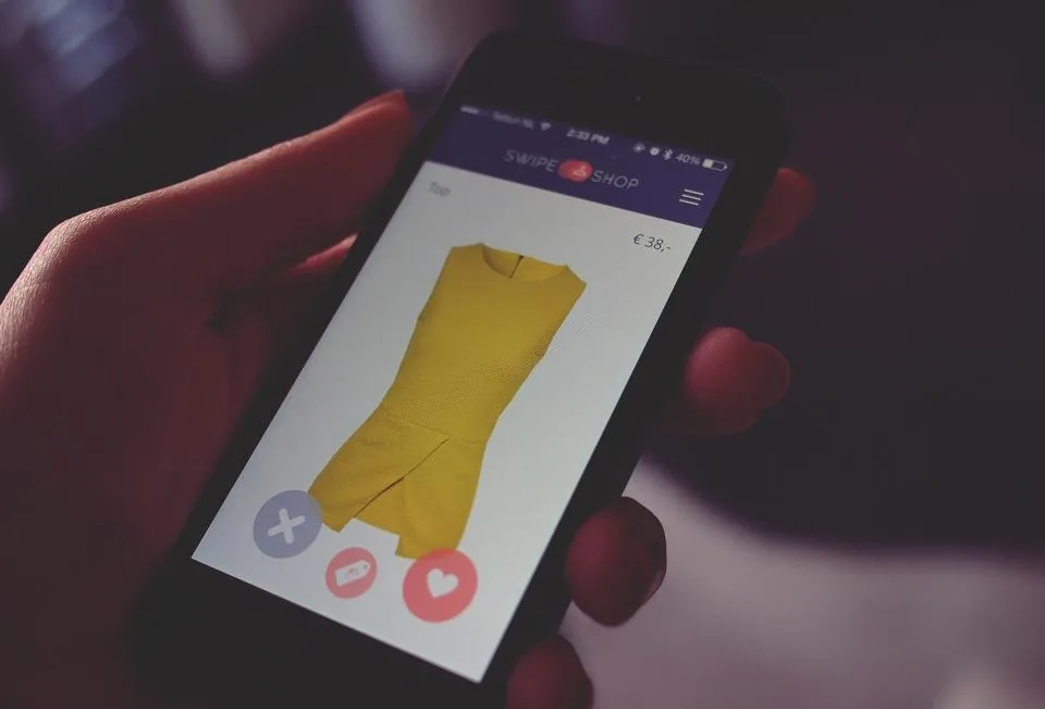 a hand holding a smartphone with the screen facing the camera