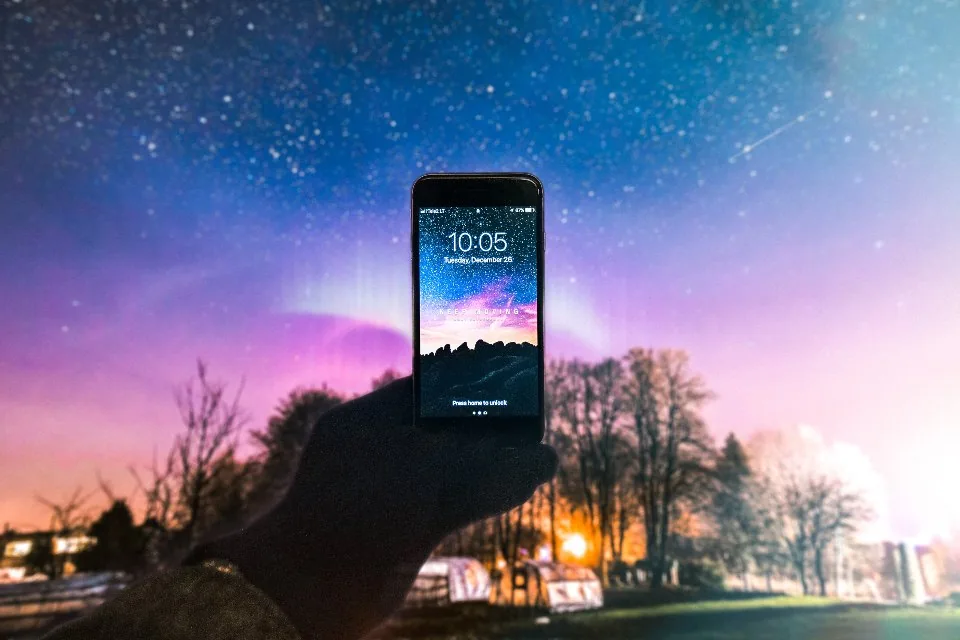 a smartphone held in one hand with an app open on the screen