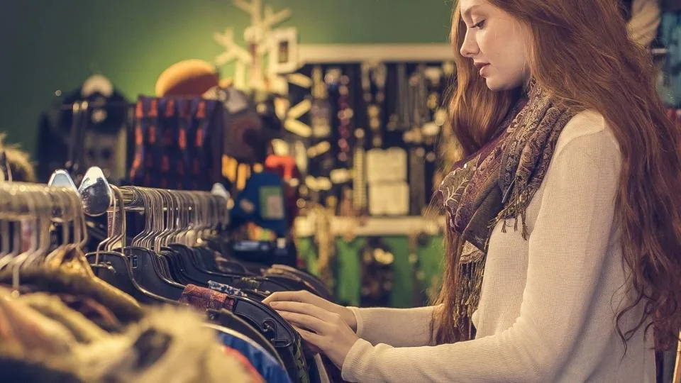 the interior of a shop with racks of stock and a counter
