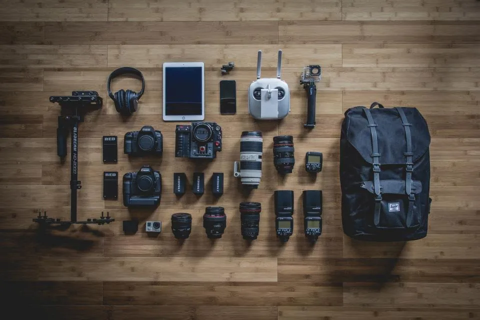 a video camera on a set with lighting and a monitor