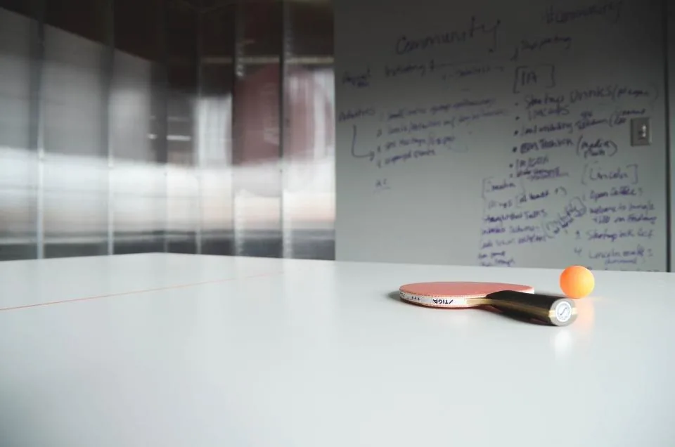 a whiteboard covered in diagrams and notes in a meeting room
