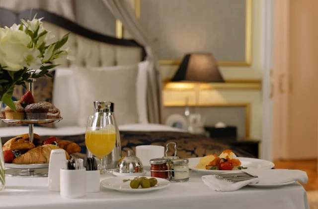 A breakfast table laid out in a hotel guest room.